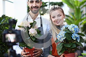 Woman and Man Vlogger Recording Blooming Flower