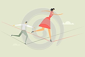 A woman and a man walking on a tight rope. Concept for moving ahead with risks and challenges