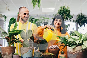 Woman and man work in florist shop.