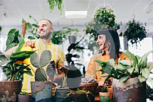 Woman and man work in florist shop.