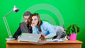 Woman and man work in office at laptop. secretary with boss at workplace. business couple at computer. businessman and