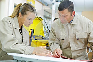 Woman and man in workshop photo