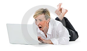 Woman manager sat on the floor with laptop