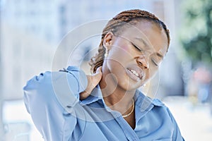 Woman manager with stress and pain in her neck while standing outside the office building. Female business leader at