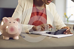 Woman managing her personal budget, calculating her income tax or business profits
