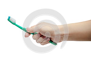 Woman manicured hand holding a toothbrush isolated on white background