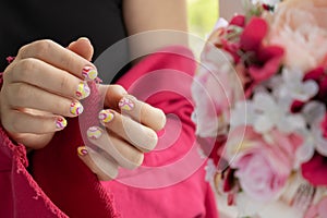 Woman manicured hands, stylish summer colorful nails. Closeup of manicured nails of female hand. Summer style of nail