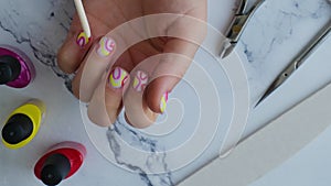 Woman manicured hands, stylish summer colorful nails. Closeup of manicured nails of female hand. Summer style of nail