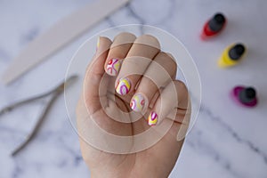 Woman manicured hands, stylish summer colorful nails. Closeup of manicured nails of female hand. Summer style of nail