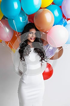 Woman with many color balloons