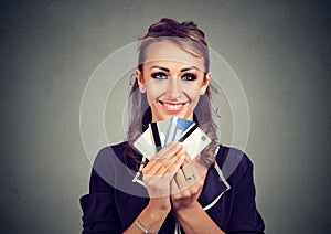 Woman with many different credit loyalty discount cards