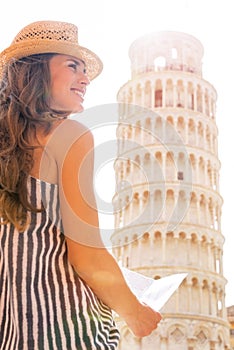 Woman with map in front of leaning tower of pisa