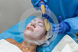 Woman in mask cosmetic procedure