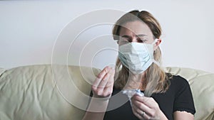 Woman mask drugs - woman sick health care emergency with pills blister - useless coronavirus antibiotics against covid