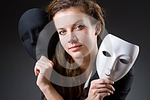 Woman with the mask in hypocrisy concept photo