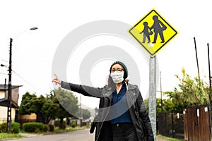 woman with mask looking for locomotion