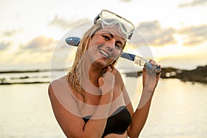 Woman with mask for snorkling at the seaside