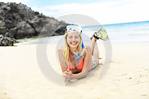 Woman with mask for snorkling at the seaside beach