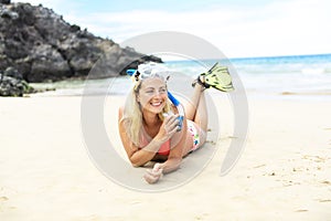 Woman with mask for snorkling at the seaside beach