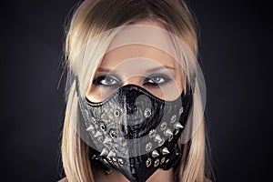 Woman in a mask with spikes