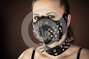 Woman in a mask with spikes