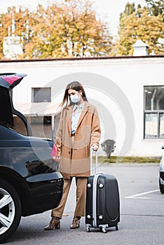 Woman in mask and stylish autumn