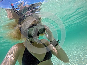 Woman in mask underwater