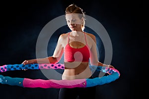 Woman with massage hula hoop