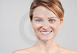 Woman with massage lines. Skin Care. Face lift anti-aging treatment photo