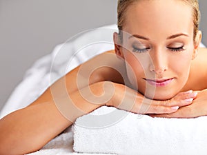 Woman, massage and spa for zen and treatment, destress and wellness for acupressure at luxury resort. Serene, peace and