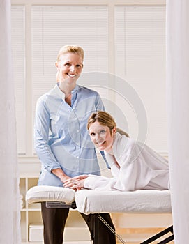 Woman and massage therapist