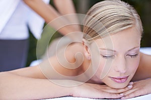 Woman, massage therapist and sleeping for treatment, back and spa for wellness and stress relief therapy. Face, masseuse