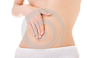 Woman massaging her slim belly