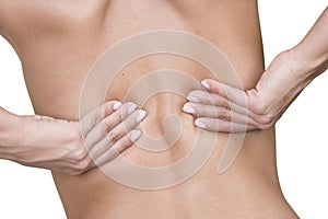 Woman massaging lower back pain photo