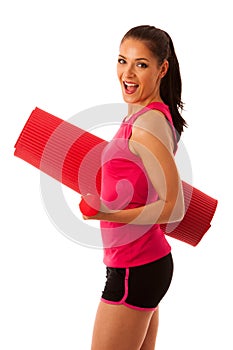 Woman with mat ready to workout isoalted over white background