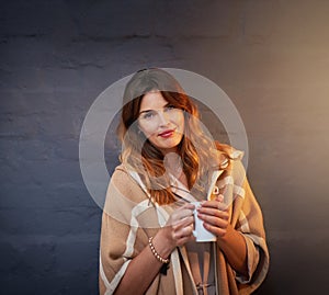 Woman, matcha and holding mug on black brick wall for casual, winter and unwind inside for morning. Cup, happiness and