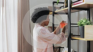 woman with matchsticks lighting candles at home