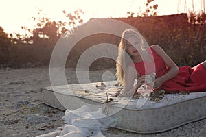 Woman on a matress outdoors photo