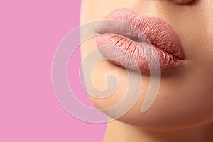 Woman with matte lipstick on pink, closeup