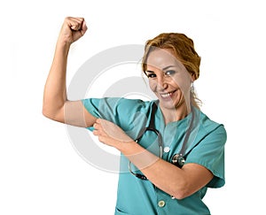 Woman md emergency doctor or nurse posing smiling cheerful with stethoscope showing biceps