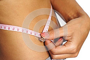 Woman measure her waist belly metre-stick