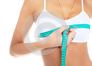 Woman measures her breast
