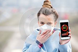 Woman measuring airpolution