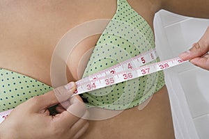 Woman Measuring Breasts photo