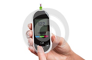 Woman measuring or checking glucose level with digital glaucometer