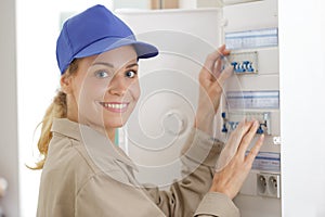 Woman measuring electrical current