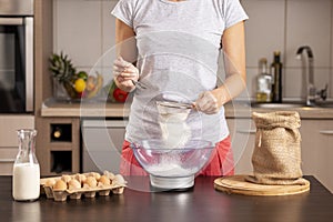 Woman measuring flour