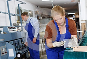 Woman measuring glass with trammel