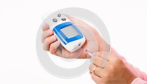 Woman measuring glucose test level checking on finger by glucometer