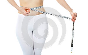 Woman measuring her abdomen